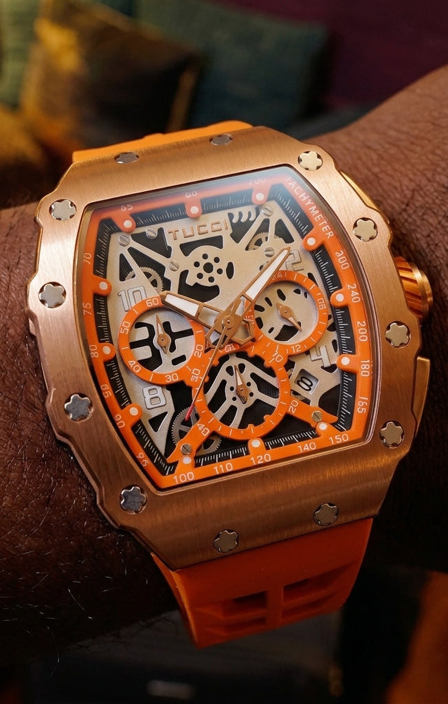 Tucci watch with orange and rose gold design on a wrist
